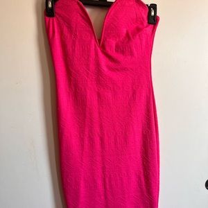 Hot pink strapless dress.